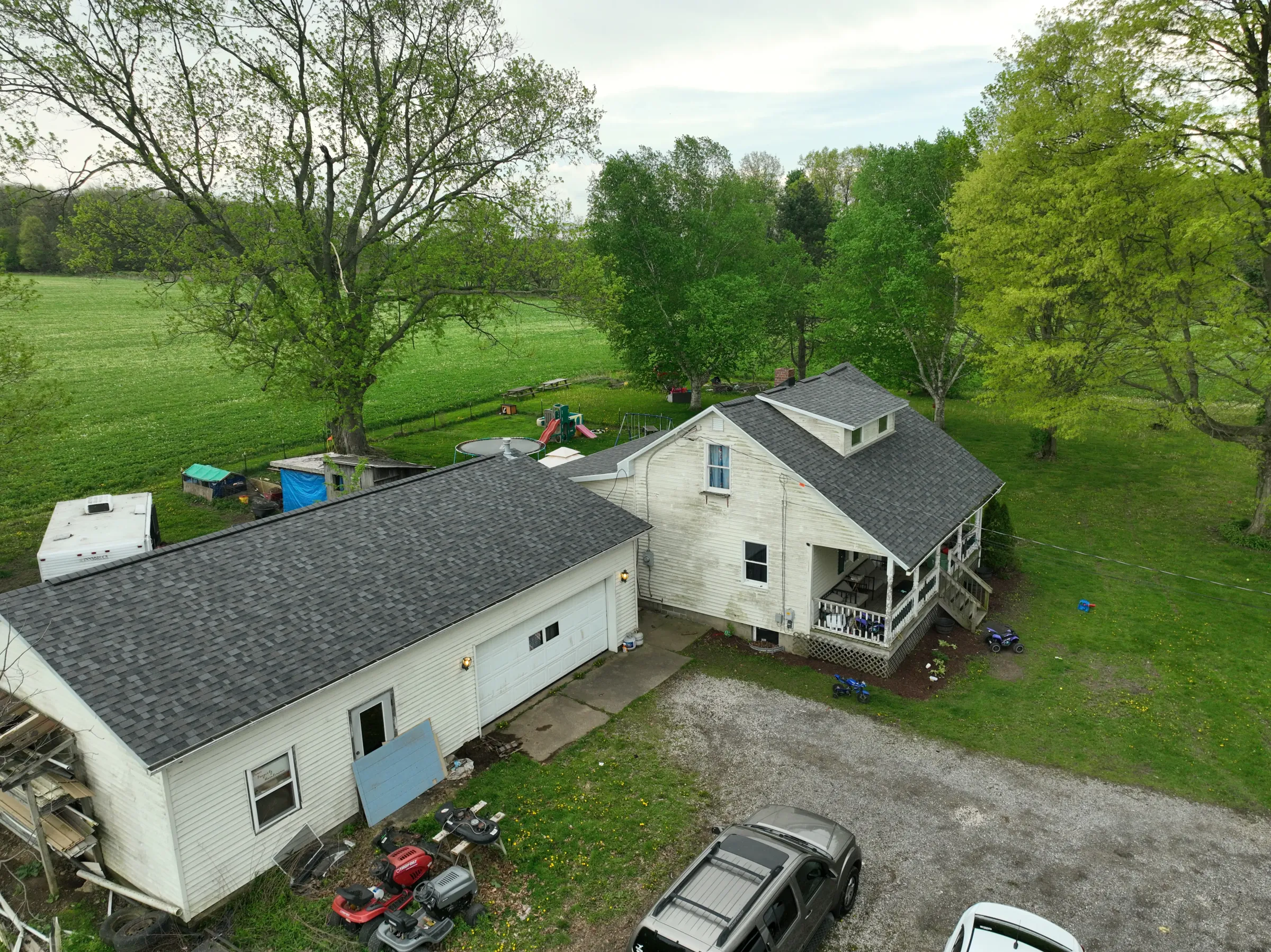 Aerial view of completed roof replacement on brick ranch home in Mansfield Ohio